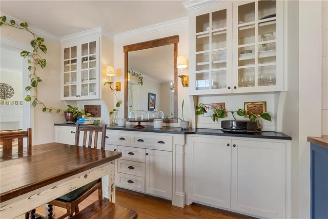 a kitchen with granite countertop a sink and cabinets