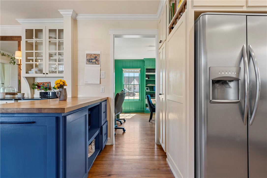 2737 Cumberland Avenue Waco, TX 76708 - Photo 17 of 45 a kitchen with kitchen island a counter top space and a refrigerator