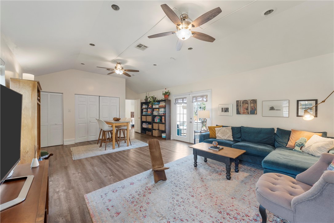 2737 Cumberland Avenue Waco, TX 76708 - Photo 22 of 45 a living room with furniture and a flat screen tv