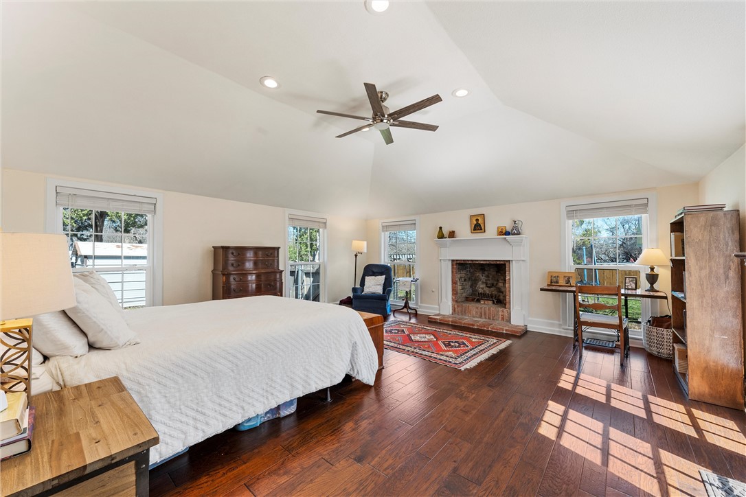 2737 Cumberland Avenue Waco, TX 76708 - Photo 24 of 45 a spacious bedroom with a bed and a fireplace