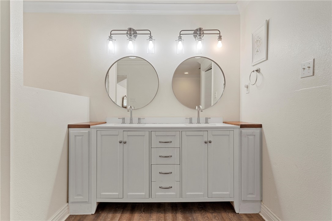 2737 Cumberland Avenue Waco, TX 76708 - Photo 28 of 45 a bathroom with a double vanity sink and a mirror