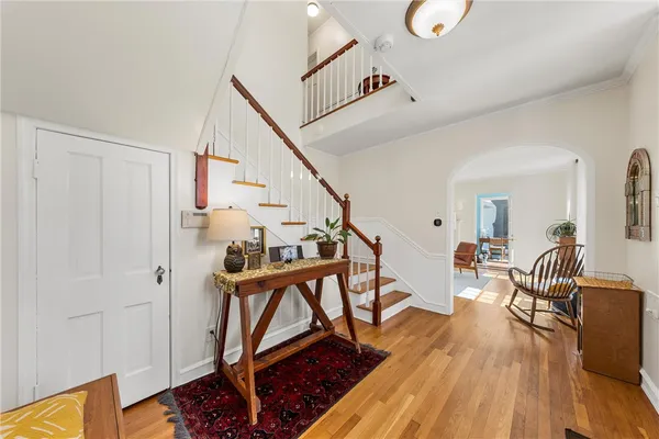 a view of entryway dining room and hall with wooden floor