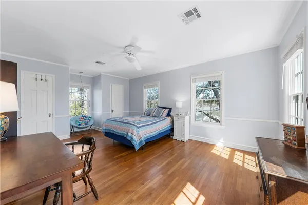 a bedroom with a bed and a table in it