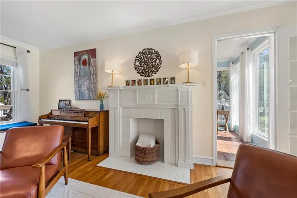 a living room with furniture and a fireplace