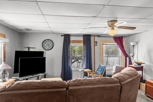 a bedroom with furniture and a flat screen tv