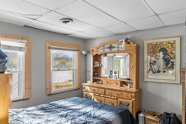 a bedroom with furniture and a window