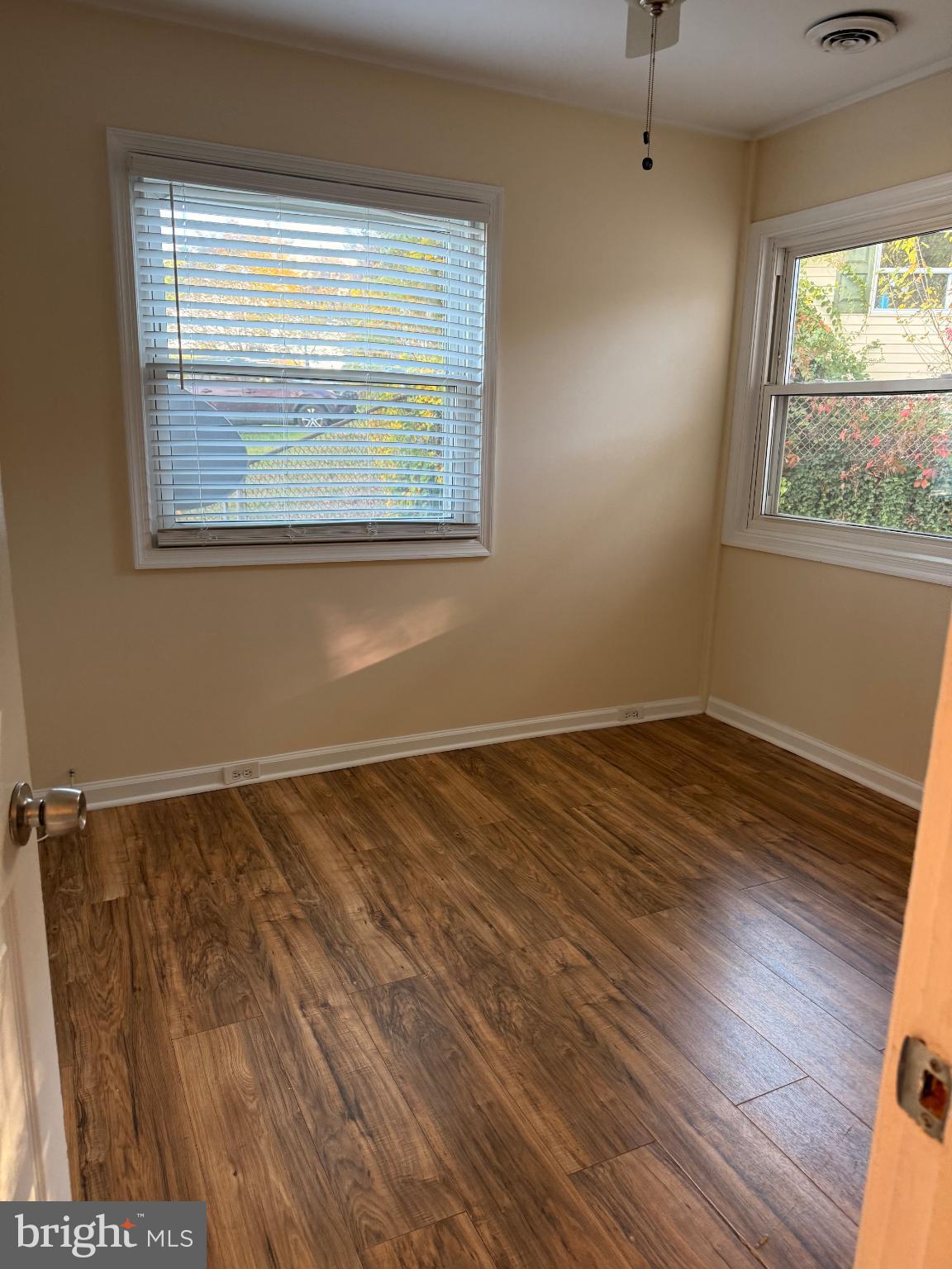 10 Compass Road Baltimore, MD 21220 - Photo 7 of 15 a view of an empty room with wooden floor and a window