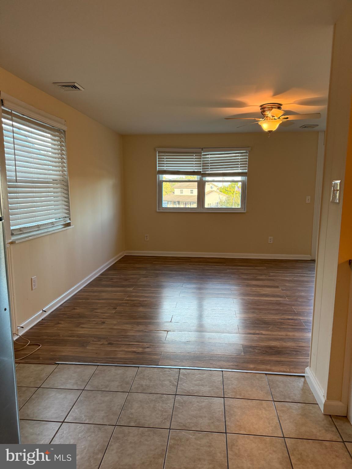 10 Compass Road Baltimore, MD 21220 - Photo 10 of 15 a view of an empty room with window and wooden floor