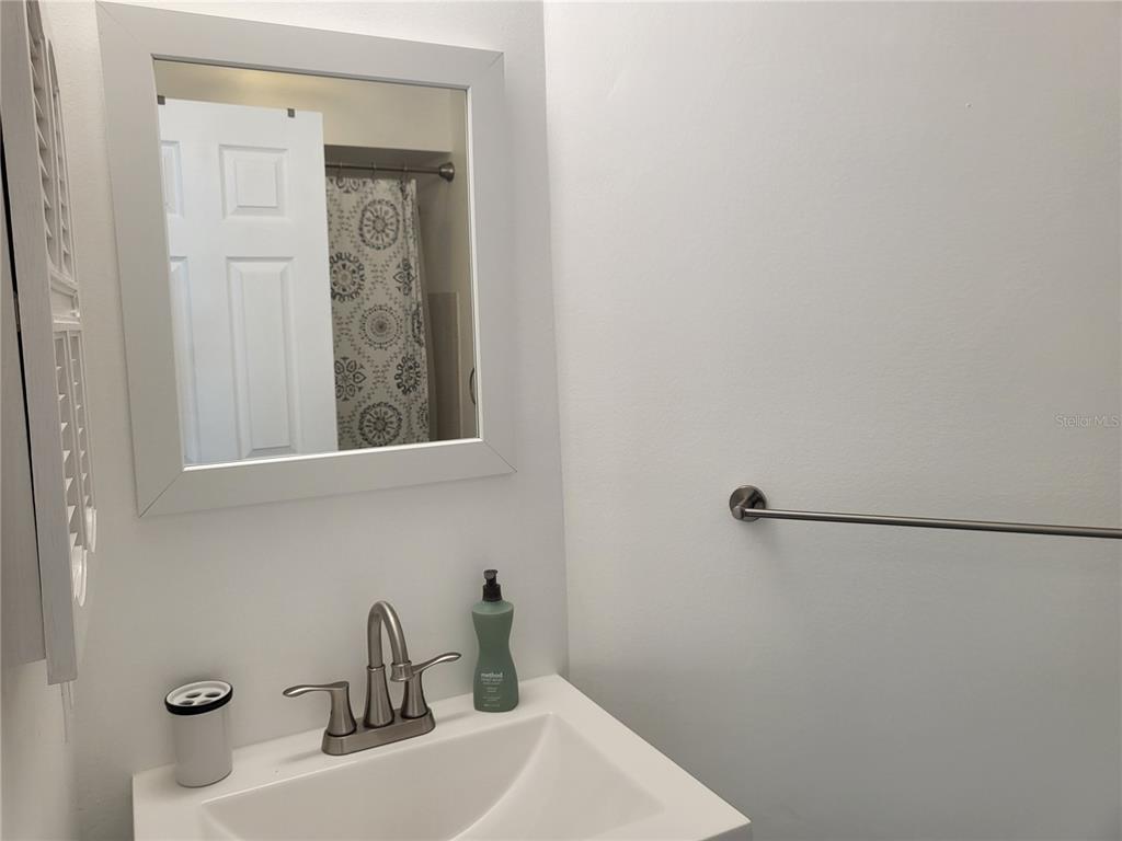 2903 63rd Street West Bradenton, FL 34209 - Photo 14 of 22 a bathroom with a sink and a mirror