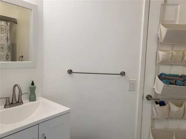 a bathroom with a sink and mirror