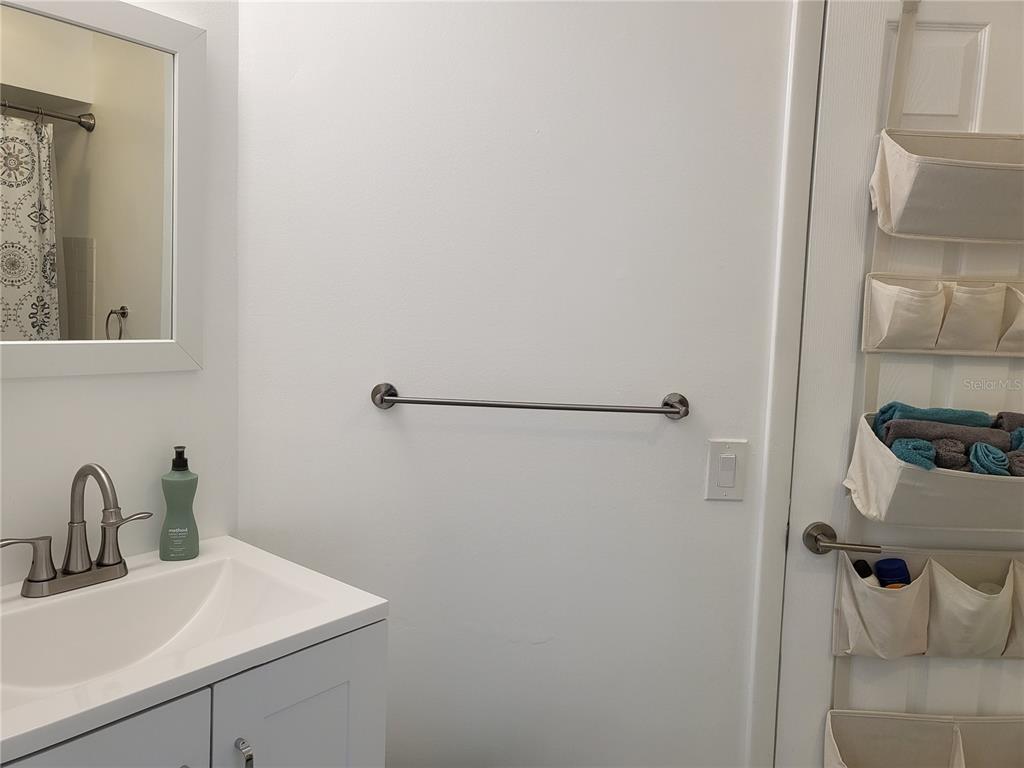 2903 63rd Street West Bradenton, FL 34209 - Photo 15 of 22 a bathroom with a sink and mirror
