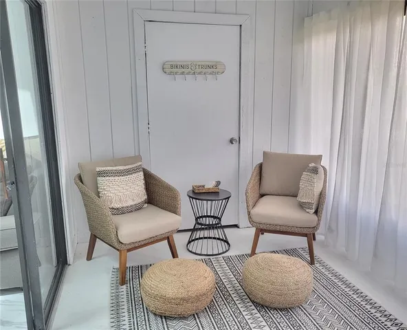 a living room with furniture and a rug