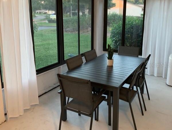 2903 63rd Street West Bradenton, FL 34209 - Photo 18 of 22 a view of a dining room with a table and chairs