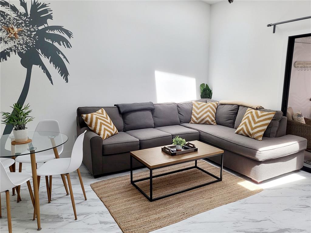 2903 63rd Street West Bradenton, FL 34209 - Photo 7 of 22 a living room with furniture and a rug