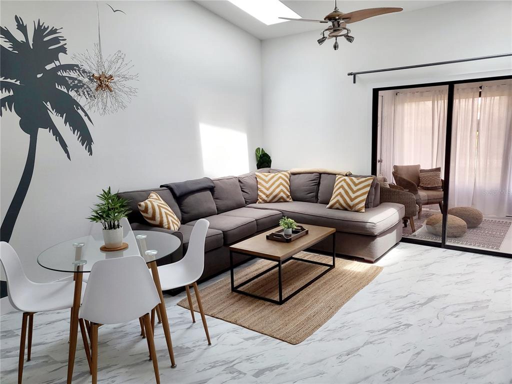 2903 63rd Street West Bradenton, FL 34209 - Photo 8 of 22 a living room with furniture and a large window