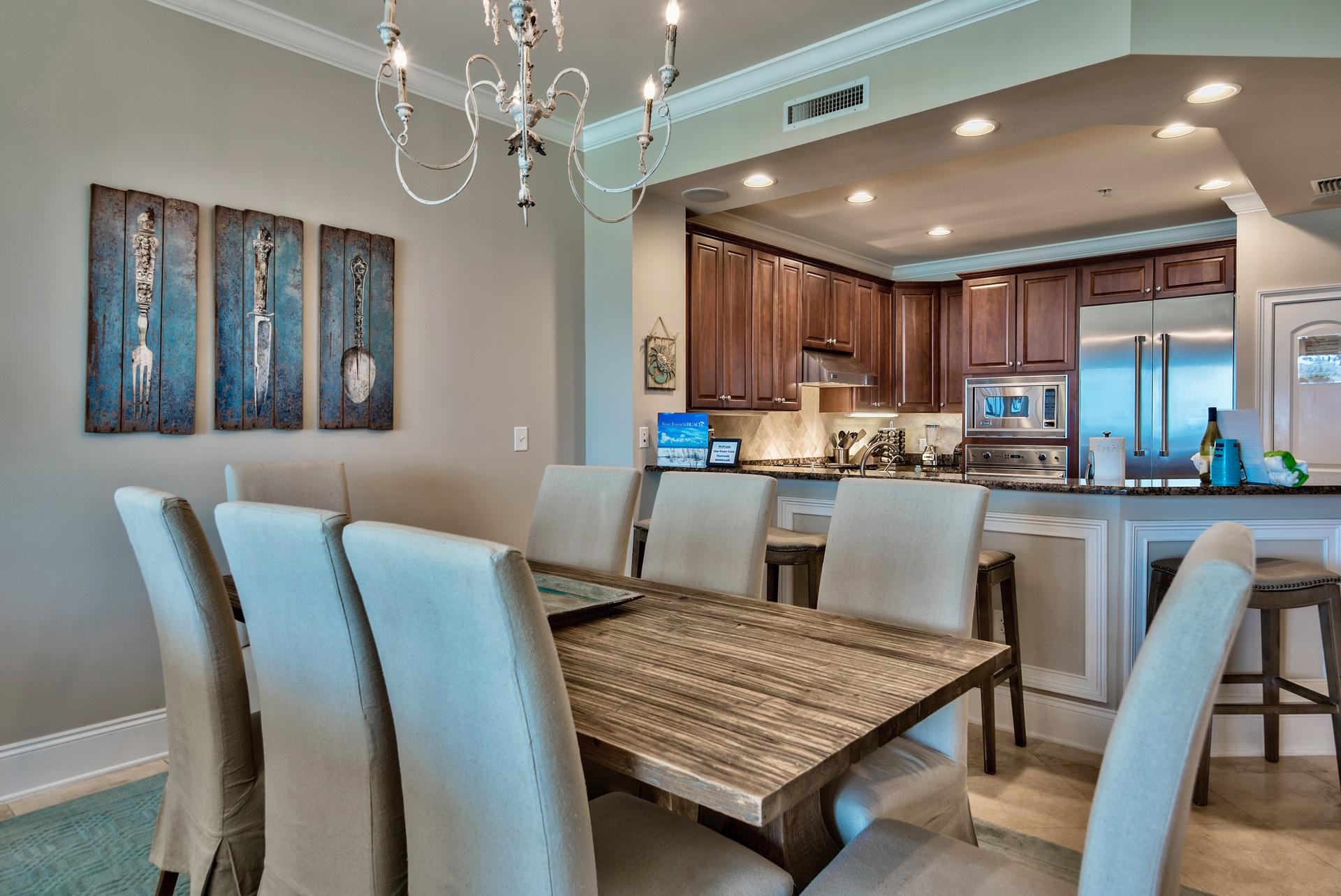 2421 West County Highway 30A, Unit C402 Santa Rosa Beach, FL 32459 - Photo 11 of 38 a living room with stainless steel appliances furniture a dining table and kitchen view