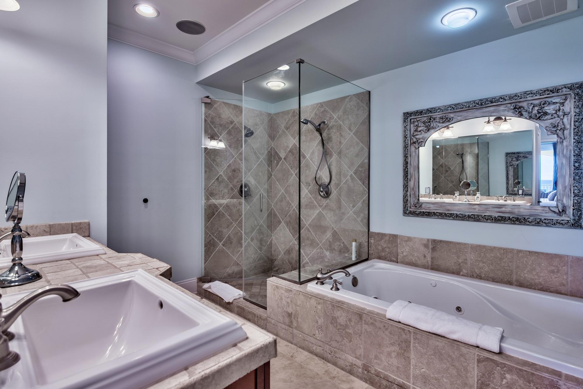 2421 West County Highway 30A, Unit C402 Santa Rosa Beach, FL 32459 - Photo 18 of 38 a bathroom with a tub a sink and mirror
