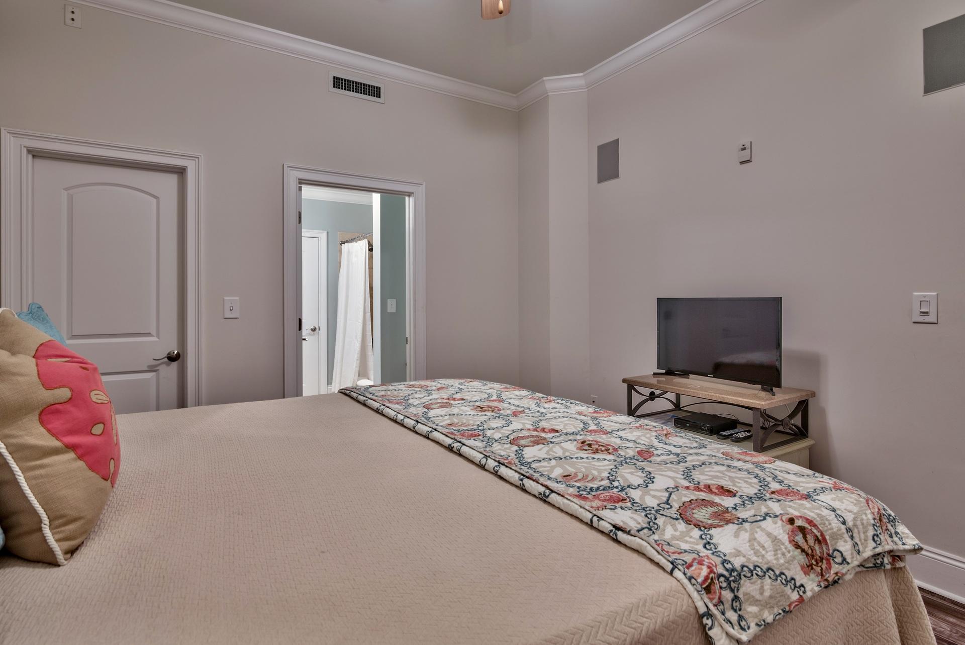 2421 West County Highway 30A, Unit C402 Santa Rosa Beach, FL 32459 - Photo 20 of 38 a bedroom with a bed and flat screen tv