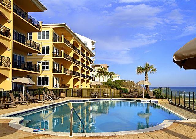 2421 West County Highway 30A, Unit C402 Santa Rosa Beach, FL 32459 - Photo 2 of 38 a view of a swimming pool with a lounge chairs