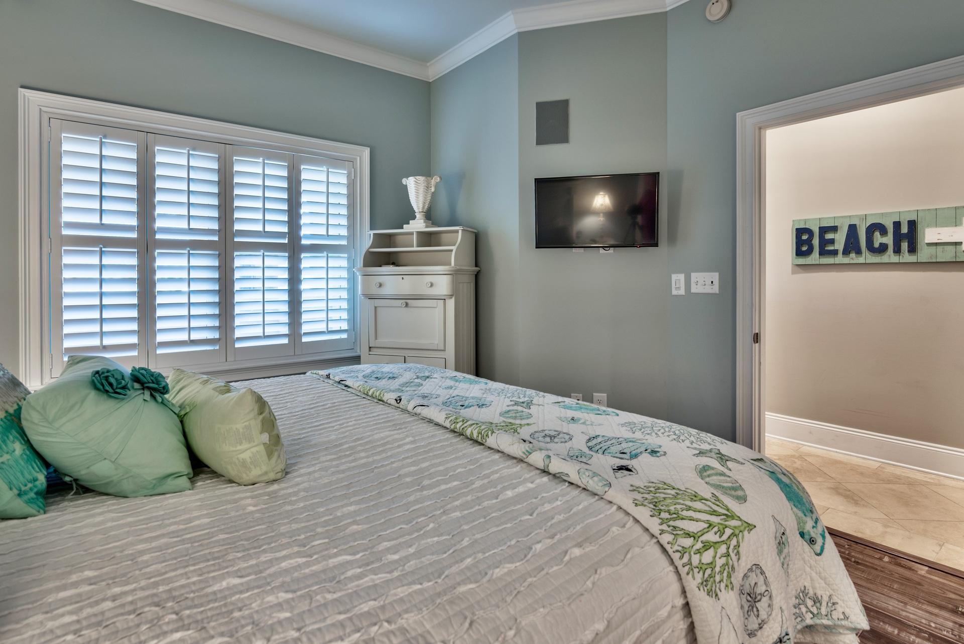 2421 West County Highway 30A, Unit C402 Santa Rosa Beach, FL 32459 - Photo 23 of 38 a bedroom with a bed and a flat screen tv