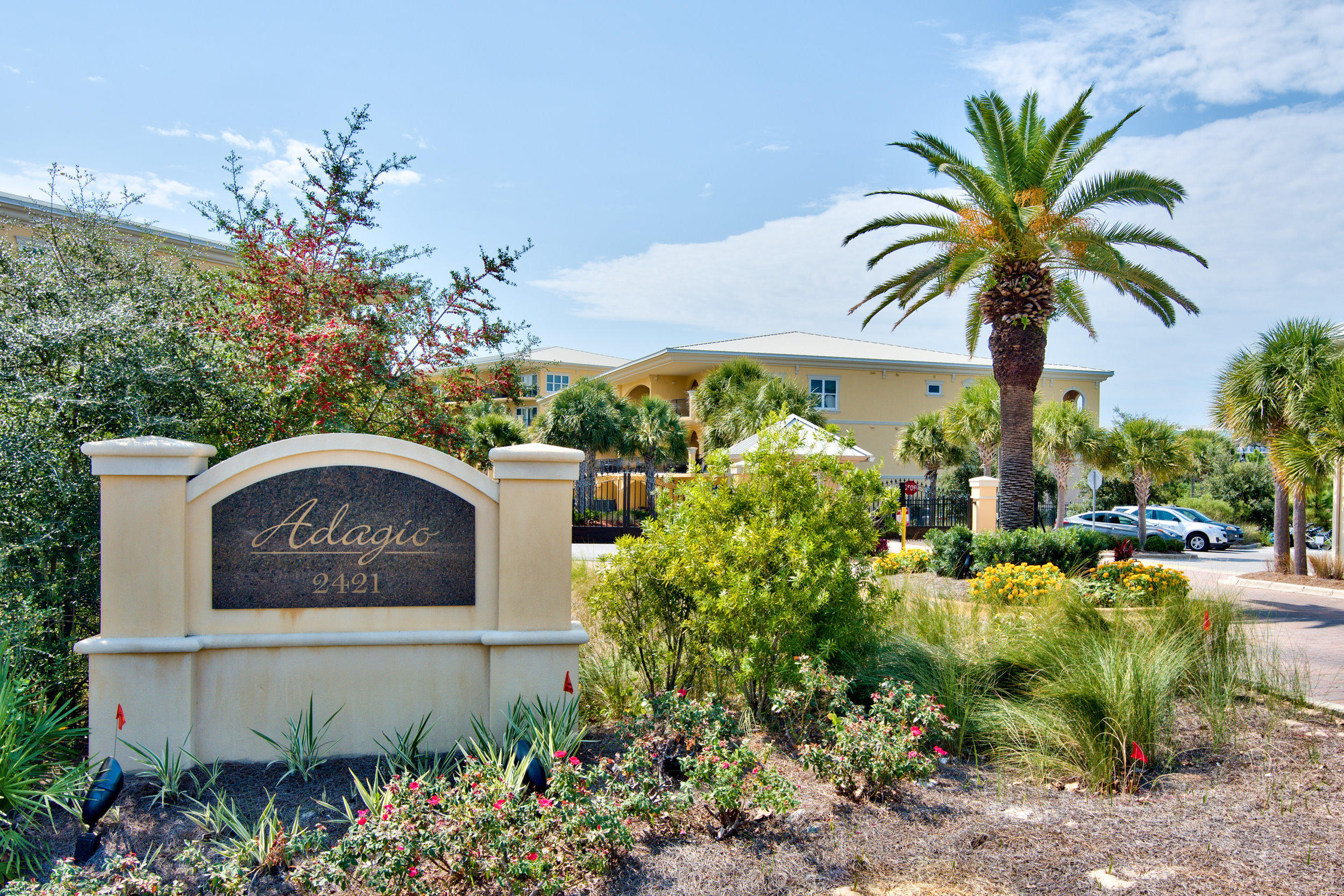 2421 West County Highway 30A, Unit C402 Santa Rosa Beach, FL 32459 - Photo 27 of 38 a view of a house with a garden and signage