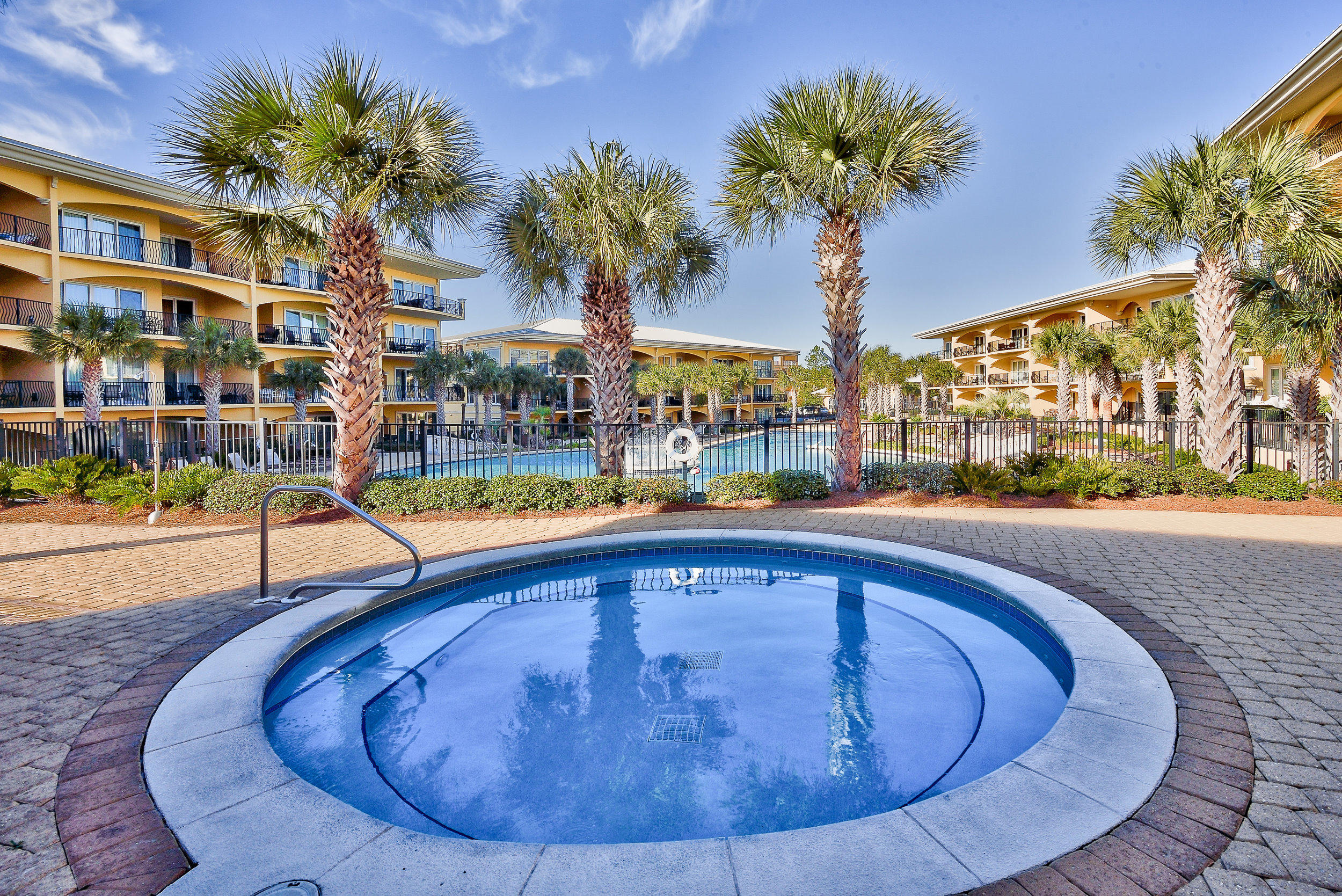 2421 West County Highway 30A, Unit C402 Santa Rosa Beach, FL 32459 - Photo 30 of 38 a swimming pool with outdoor seating and yard