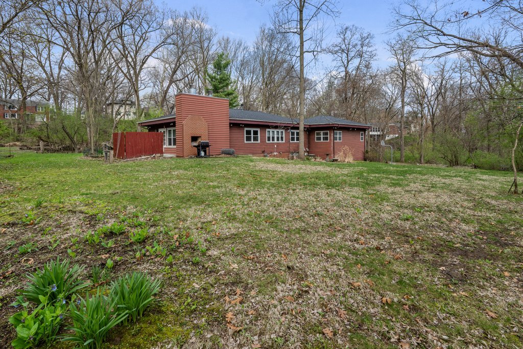 1031 27th Street Moline, IL 61265 - Photo 11 of 36 a view of a house with a yard and large trees