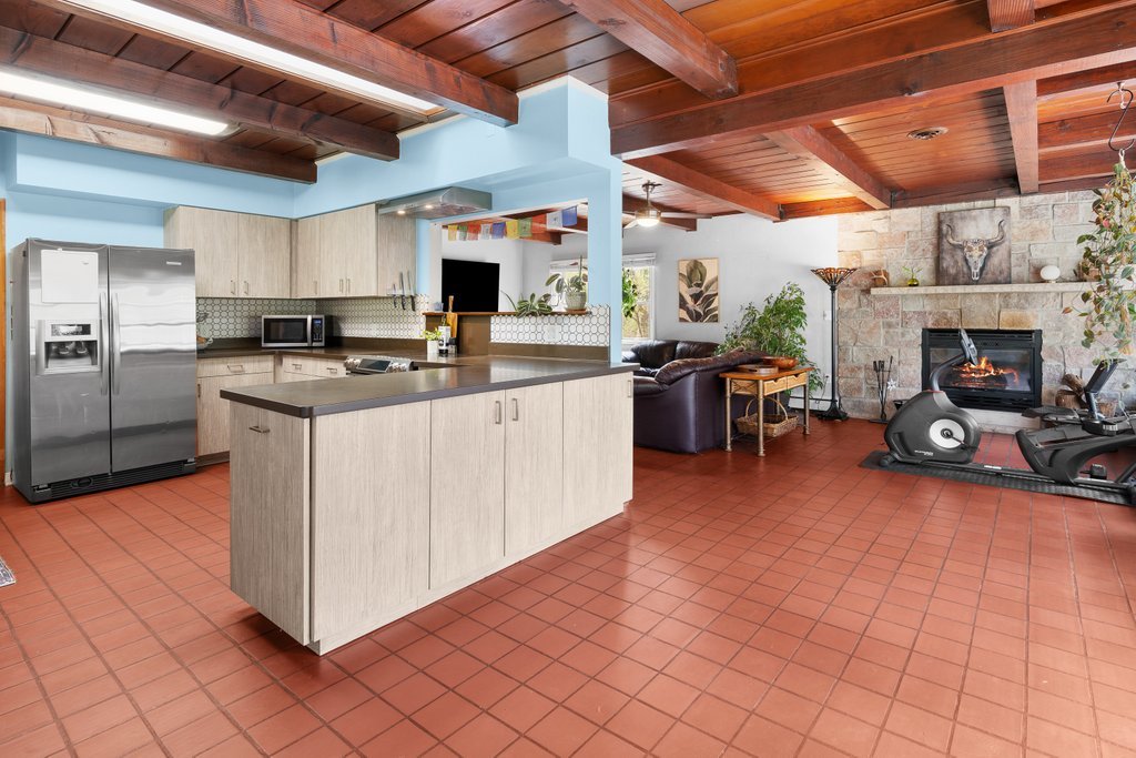 1031 27th Street Moline, IL 61265 - Photo 13 of 36 a kitchen with stainless steel appliances granite countertop a sink and cabinets