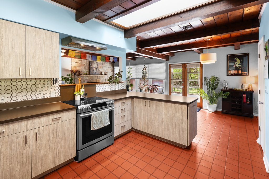 1031 27th Street Moline, IL 61265 - Photo 20 of 36 a kitchen with stainless steel appliances granite countertop a stove a sink and a microwave