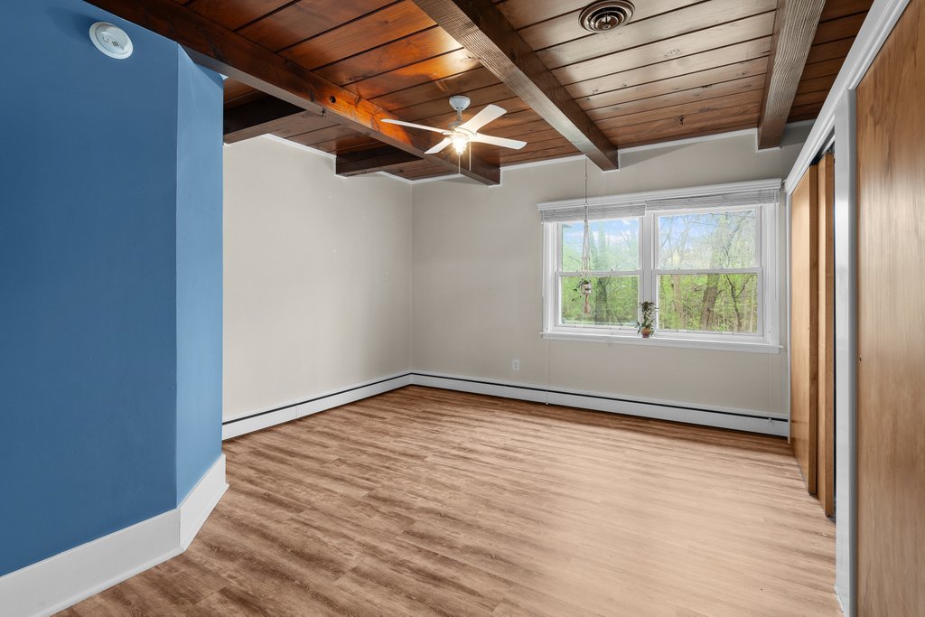 1031 27th Street Moline, IL 61265 - Photo 24 of 36 an empty room with wooden floor and windows