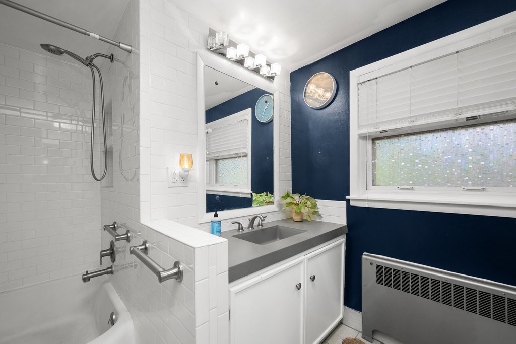 1031 27th Street Moline, IL 61265 - Photo 26 of 36 a bathroom with a sink and a mirror