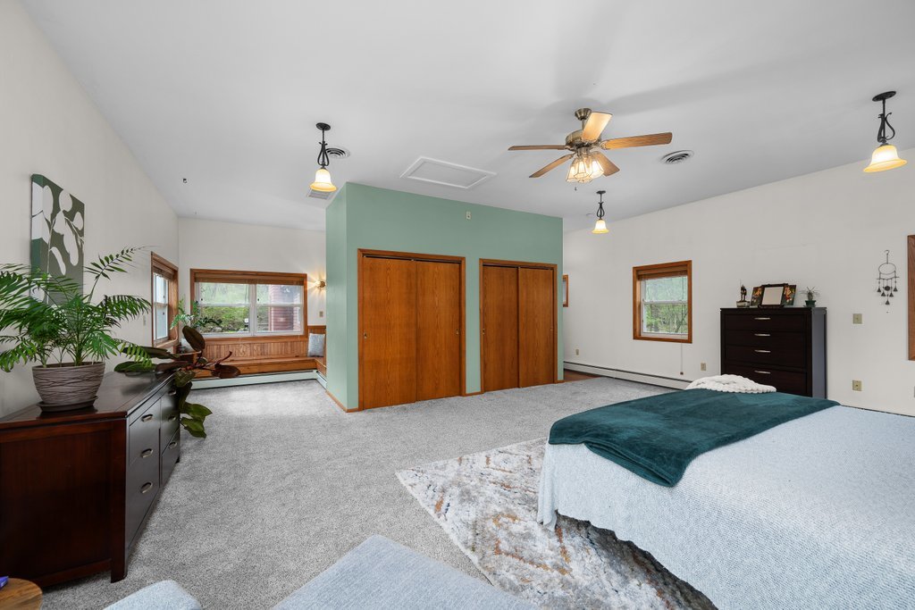 1031 27th Street Moline, IL 61265 - Photo 31 of 36 a large bedroom with furniture and windows