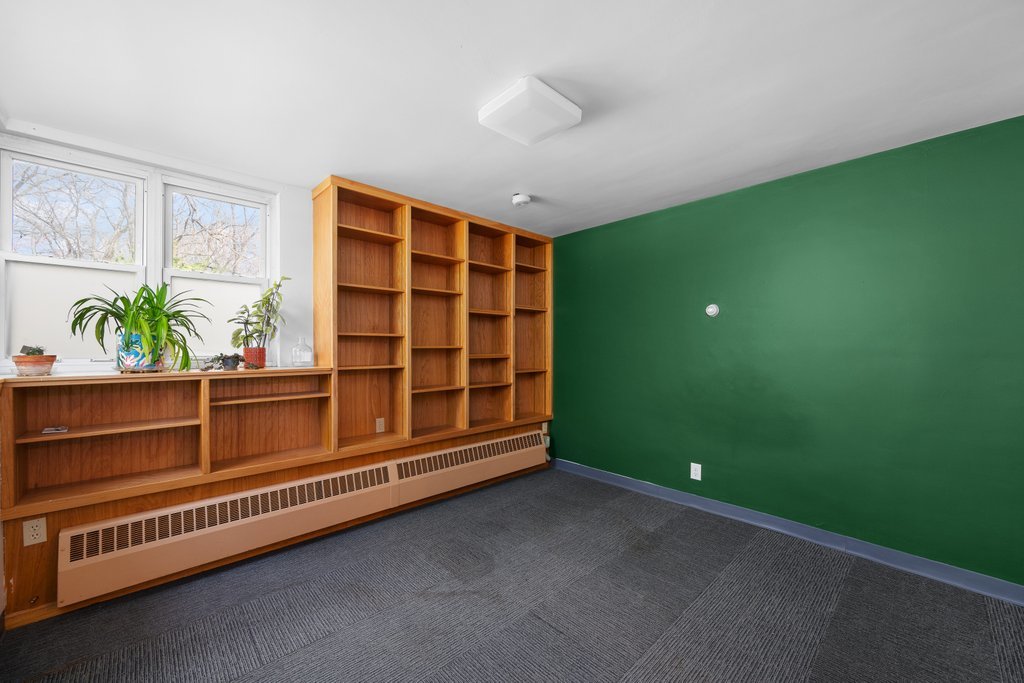 1031 27th Street Moline, IL 61265 - Photo 34 of 36 a view of an empty room with windows & cabinet