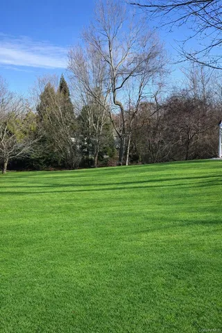 a backyard of a house with lots of green space