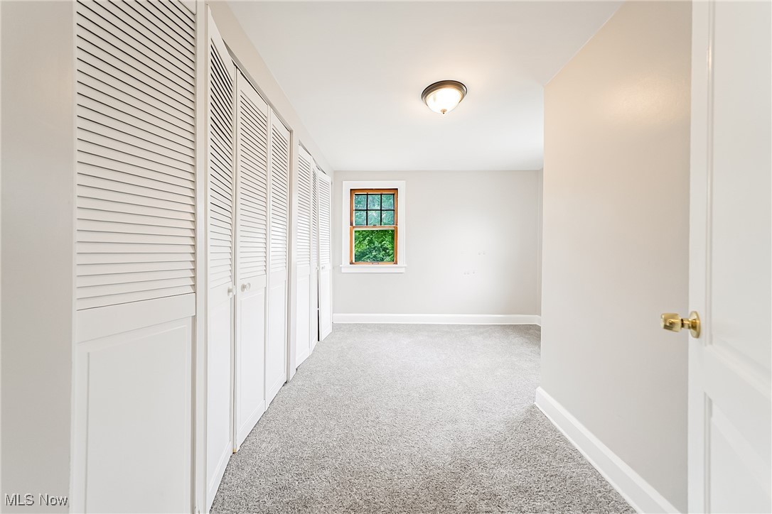 1271 Winston Road Cleveland, OH 44121 - Photo 21 of 43 Corridor featuring carpet floors and baseboards