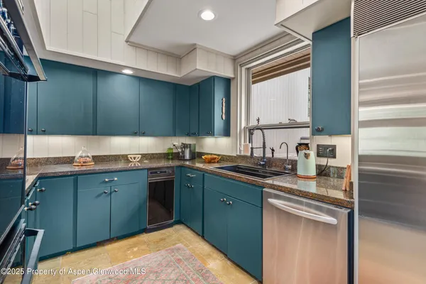 a living room with furniture a mirror and sink