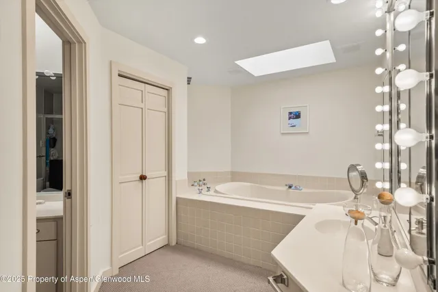 a bedroom with bed and flat screen tv