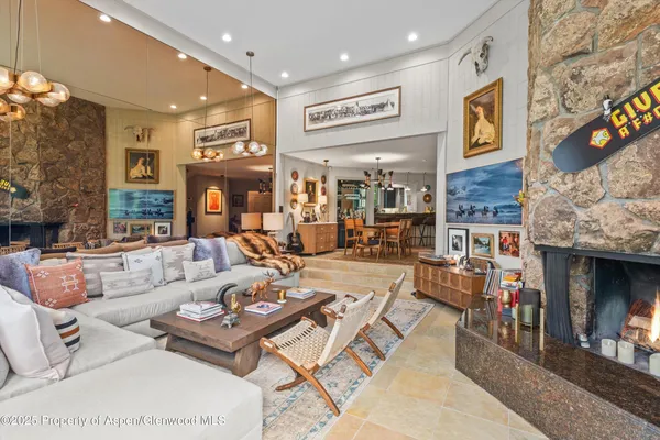 a living room with fireplace furniture and a fireplace