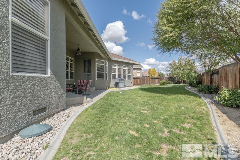 9960 Moccasin Court Reno, NV 89521 - Photo 17 of 20 a view of a house with a yard