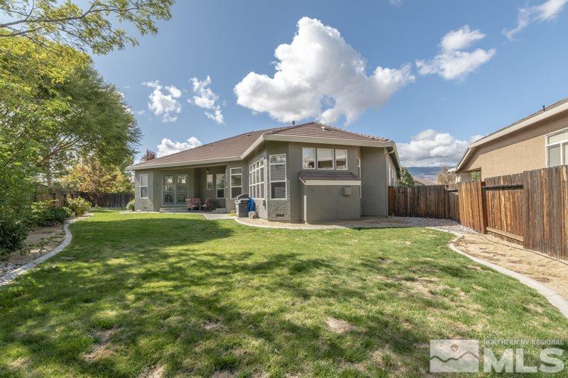 9960 Moccasin Court Reno, NV 89521 - Photo 18 of 20 a view of a house next to a yard