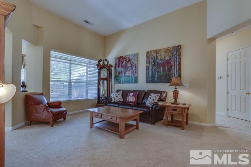 9960 Moccasin Court Reno, NV 89521 - Photo 4 of 20 a living room with furniture and a large window