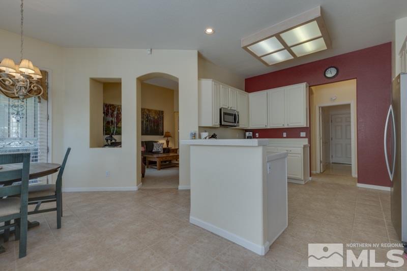 9960 Moccasin Court Reno, NV 89521 - Photo 6 of 20 a view of kitchen with cabinets and refrigerator