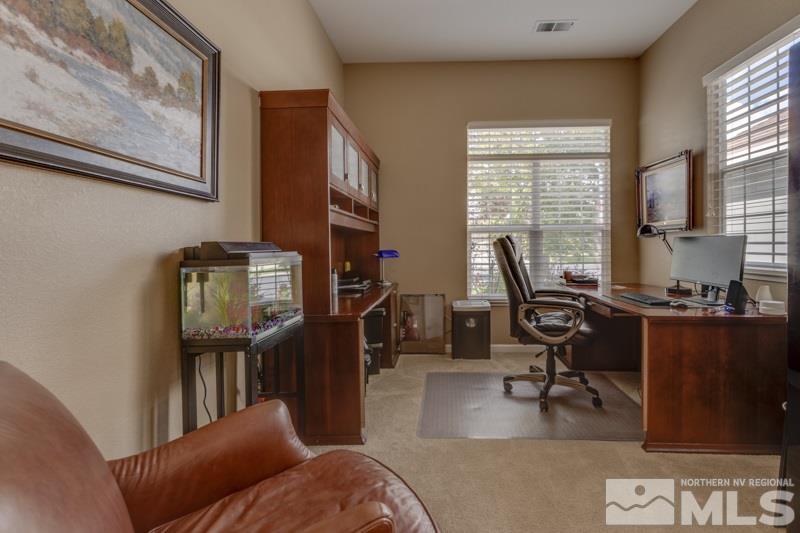 9960 Moccasin Court Reno, NV 89521 - Photo 10 of 20 a living room with furniture a window and a flat screen tv
