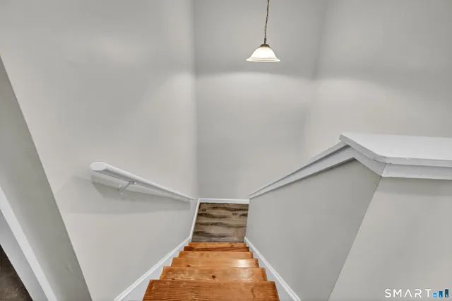 a view of a hallway with a white door