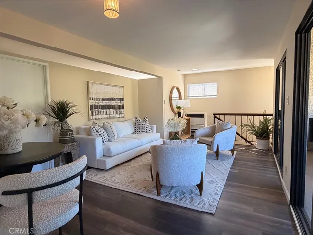 a kitchen with a stove a sink and a white cabinets