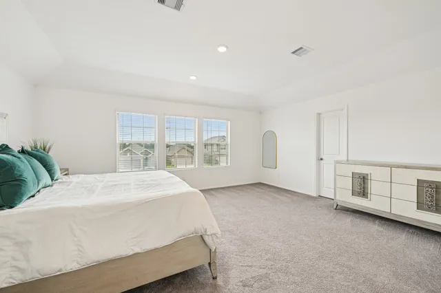 a bathroom with a sink mirror and toilet