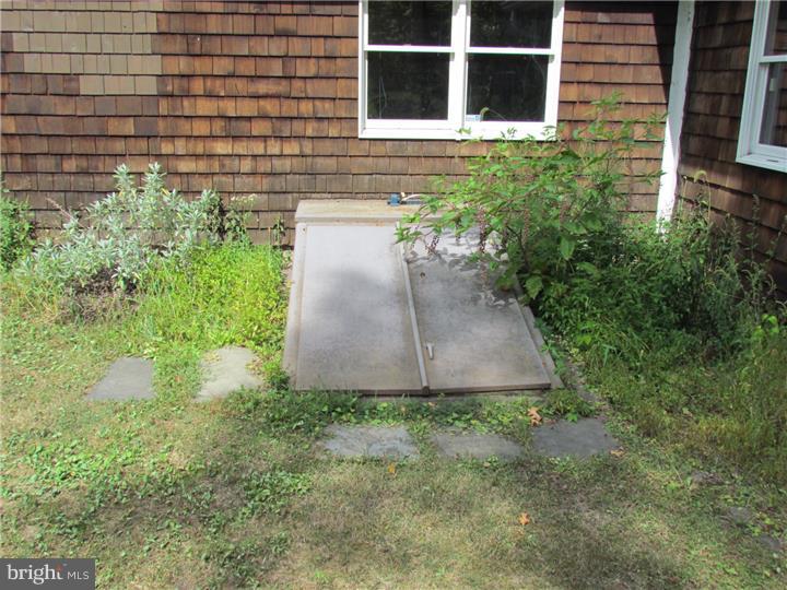 3085 Ridge Road Perkasie, PA 18944 - Photo 22 of 25 a view of a pathway besides a building