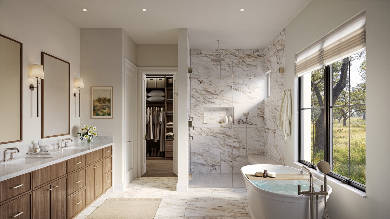 _ Prominence Road Spicewood, TX 78669 - Photo 4 of 26 a bathroom with a double vanity sink toilet and shower