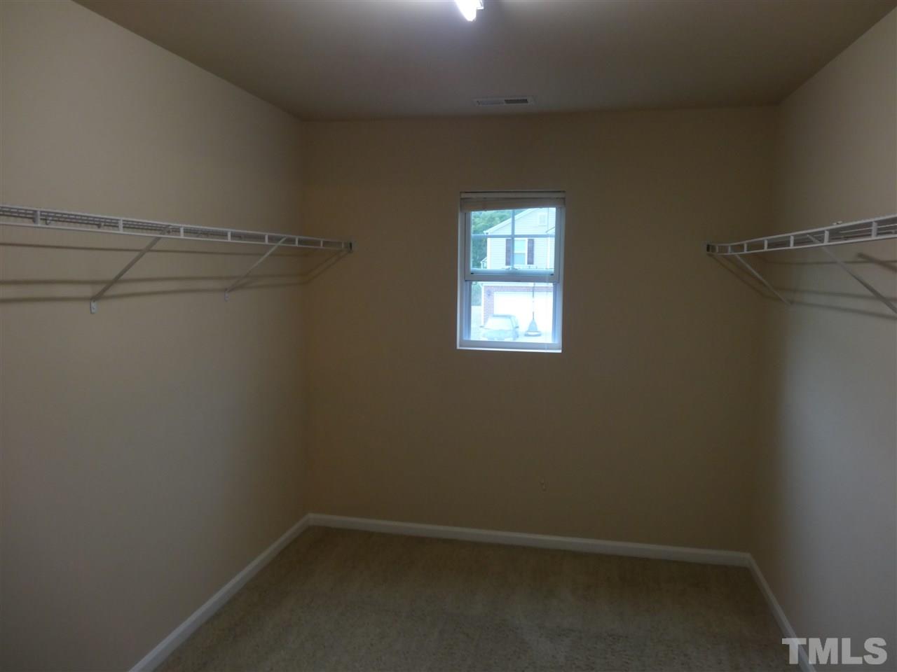 6835 Horseback Lane Raleigh, NC 27610 - Photo 15 of 25 a view of a room with rack on the wall and a window