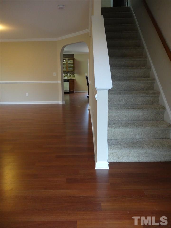 6835 Horseback Lane Raleigh, NC 27610 - Photo 3 of 25 a view of entryway and hall with wooden floor